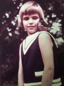 Me with my pet baby robin named Vogel